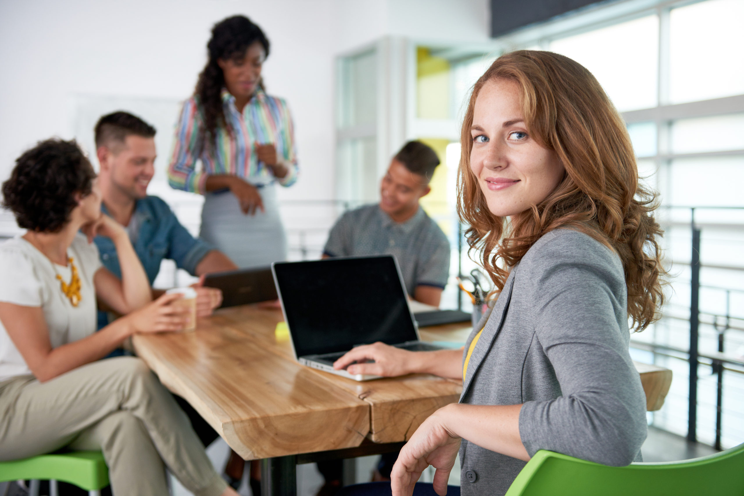 Pleased HR employee at conference table